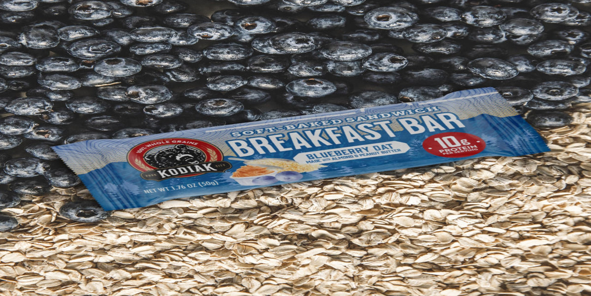 Kodiak Cakes Blueberry Oat Bar cross-section reveals fruit-filled, moist interior