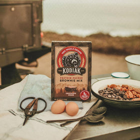 Kodiak Cakes Brownie Mix batter stir for effortless prep and 8g protein per serving.