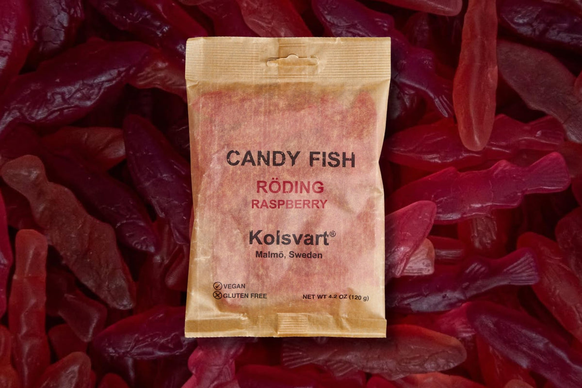 Kolsvart office snack idea with a colorful assortment of gummies on a desk.