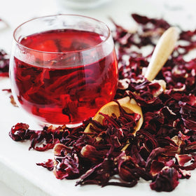 KomBei jamaica-style hibiscus tea preparation using dried flowers.