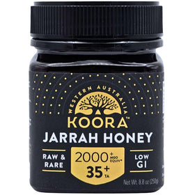 KOORA Jarrah honey bottle being poured, offering natural energy and antioxidant support.