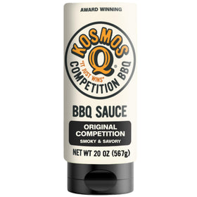 Kosmos Q Original Competition BBQ Sauce bottle on a wooden table, ready to enhance grilled meals
