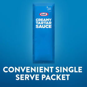 Kraft Creamy Tartar Sauce packet dipping action beside fish and fries.