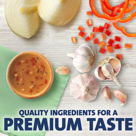 Creamy Kraft Golden Italian dressing pours over a crisp green salad