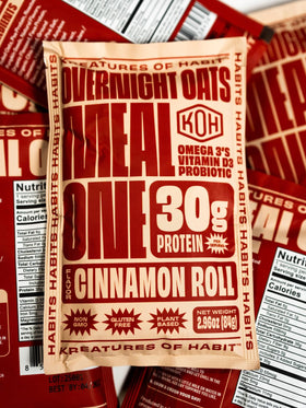Kreatures of Habit Meal One plant-based protein powder bag ready for mixing.