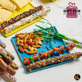 KREMERY pretzel rods with colorful toppings, ideal for celebrations.