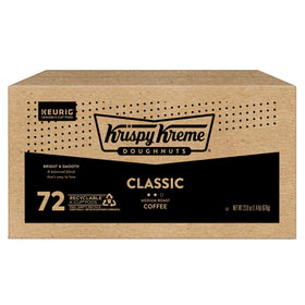 Krispy Kreme coffee cup on a desk, ready to energize work moments.