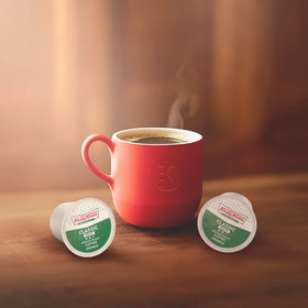 Label close-up shows kosher certification and trusted Krispy Kreme heritage.