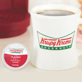 Krispy Kreme brand portrait with coffee cup and donuts