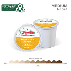 Recyclable Krispy Kreme K-Cup pods displayed with recycling guidance symbol.