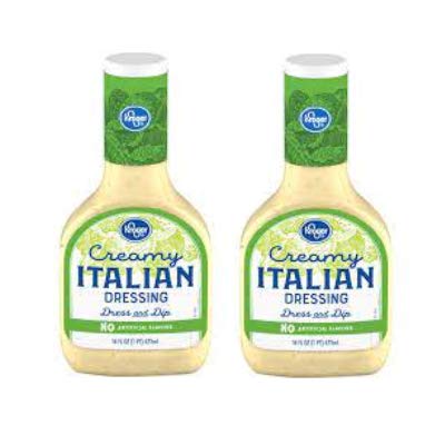 Kroger Creamy Italian Dressing bottle pouring over greens delivers a creamy tangy flavor.