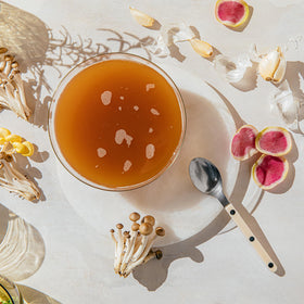 KROMA 24K glass with broth ready to serve