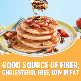 Krusteaz fluffy pancakes stack with golden brown edges.
