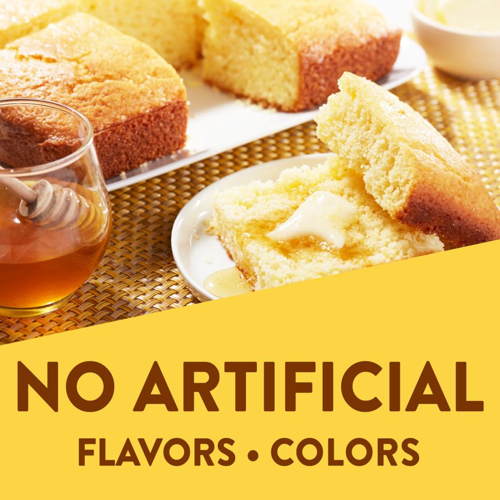 Krusteaz Honey Cornbread Mix in a bowl, ready to blend with milk and eggs