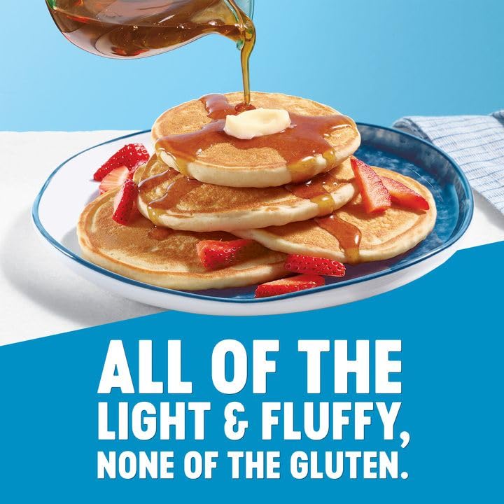 Pancakes cooking on a griddle with light and fluffy texture.