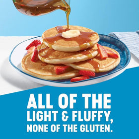 Pancakes cooking on a griddle with light and fluffy texture.