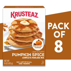 Krusteaz batter in a bowl ready to whisk into pumpkin-spice pancakes.