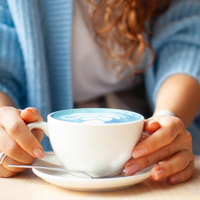 Hot water dissolves Kuli Kuli latte mix into a creamy plant-based beverage