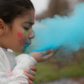 Powder splash in the air during Holi with Kulture Khazana colors