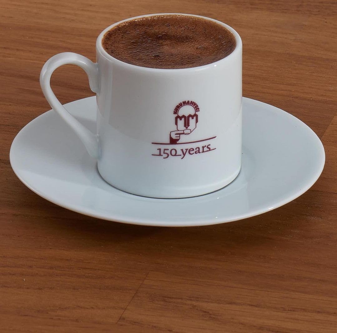 Foamy Turkish coffee cup capturing signature crema.