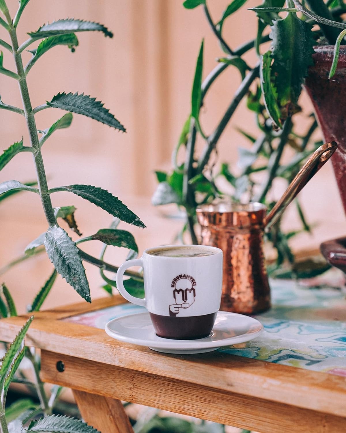 Kurukahveci Mehmet Efendi cup with steam highlighting cafe-quality brew