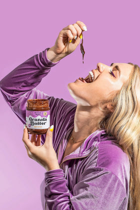 KWEEN Oat Haus Brownie Batter Granola Butter being scooped for a quick snack