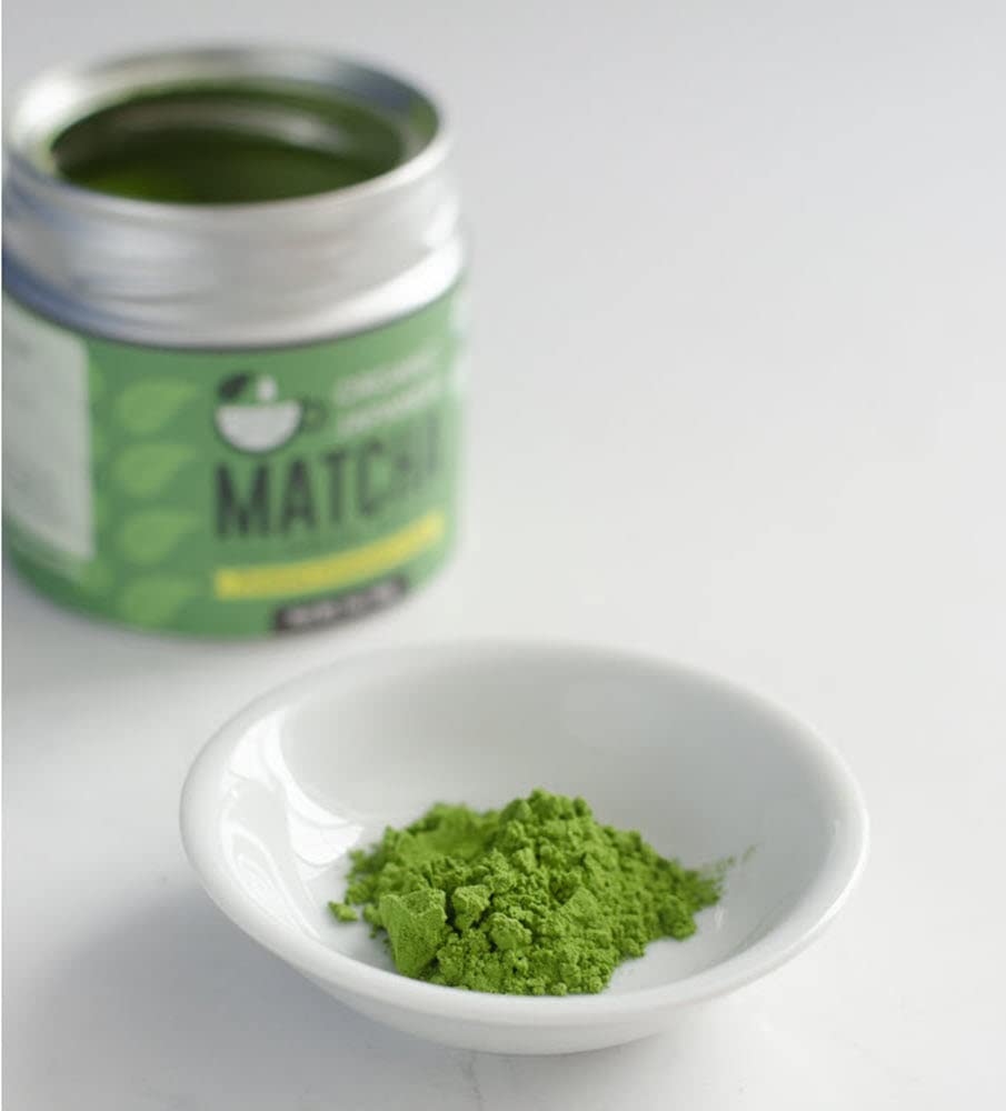 Kyoto Dew Matcha powder in bowl with whisk shows vibrant color and texture.