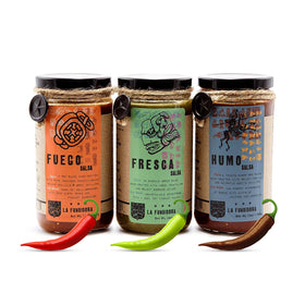 La Fundidora Humo salsa bottle pour — smoky flavor that enhances grilled dishes.