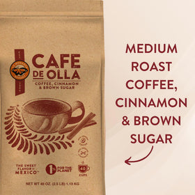 La Monarca Café de Olla grounds next to brown sugar crystals.