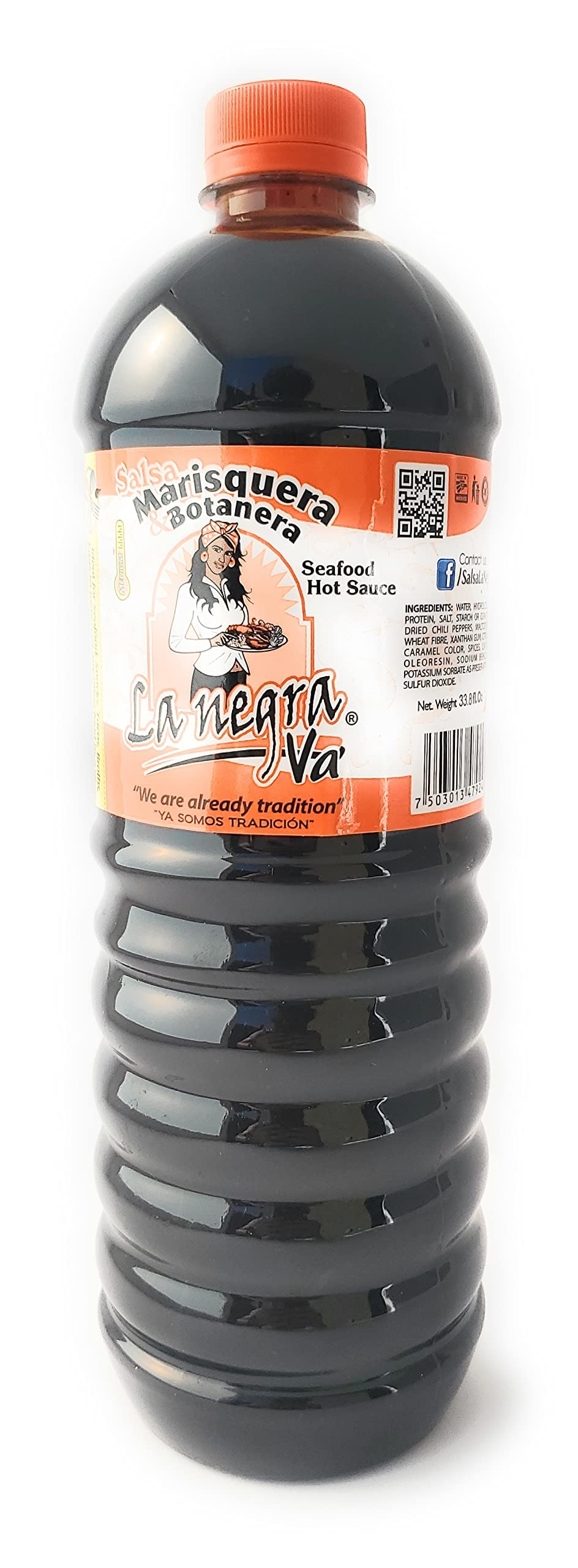 La Negra Va bottle pouring sauce onto seafood, quick flavor boost.