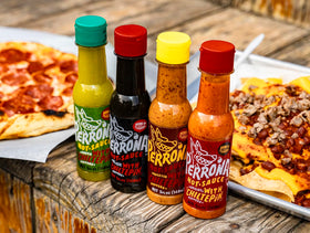 La Perrona kitchen scene with hot sauce display and ingredients