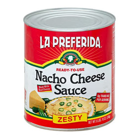 La Preferida Nacho Cheese Sauce warming in a slow cooker for dipping.