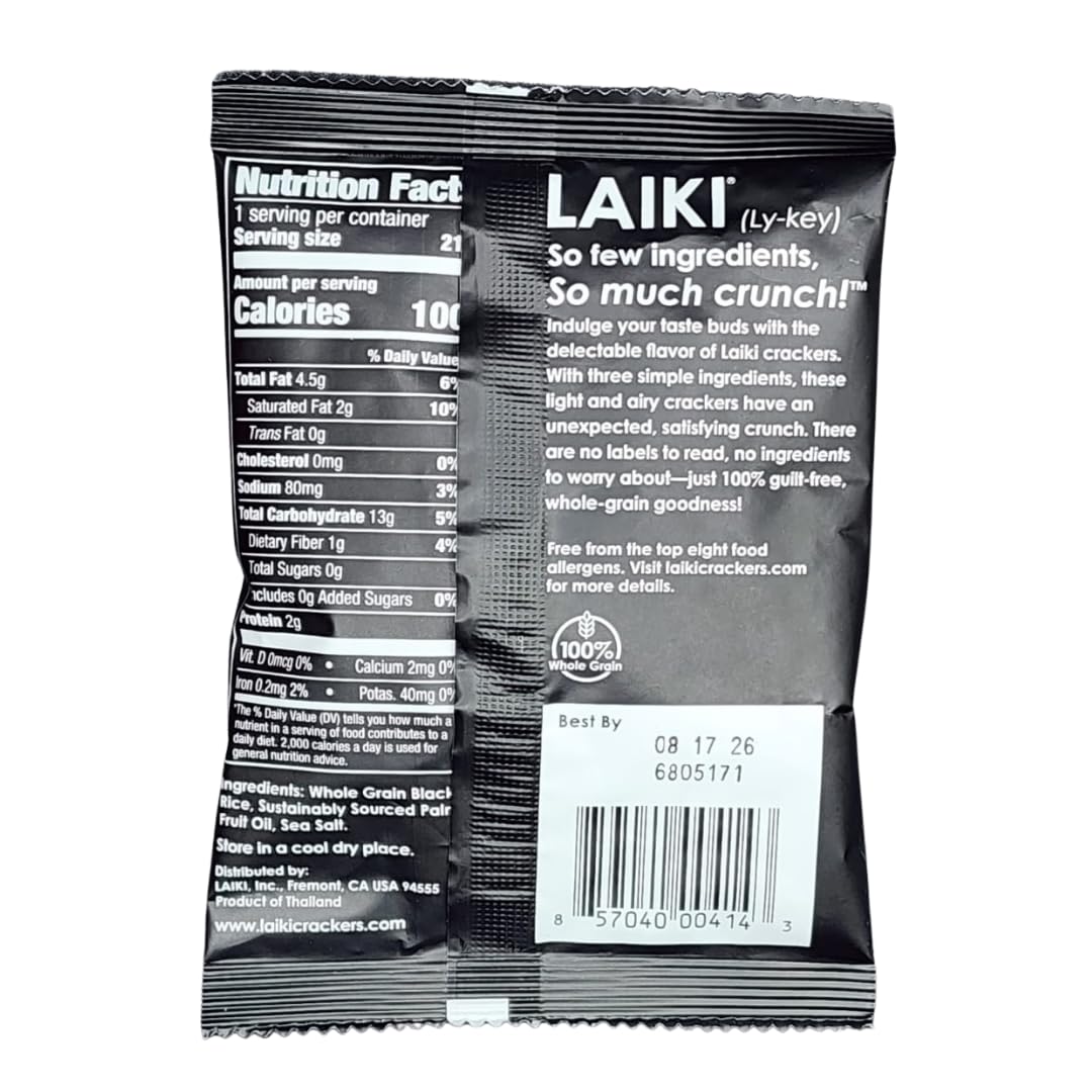 LAIKI gluten-free crackers black closeup bite, crisp texture perfect with hummus.