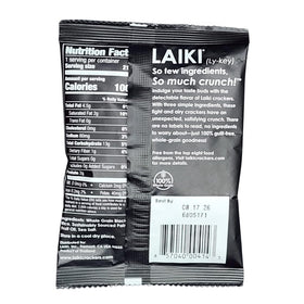 LAIKI gluten-free crackers black closeup bite, crisp texture perfect with hummus.