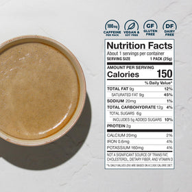 Laird Superfood Instant Latte sachet in a travel cup for vegan mornings