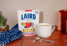 Laird Superfood Maca Instant Latte scoop of maca powder ready to blend into a creamy drink.