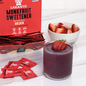 Hands with Lakanto sachet showing portable sweetness on the go.