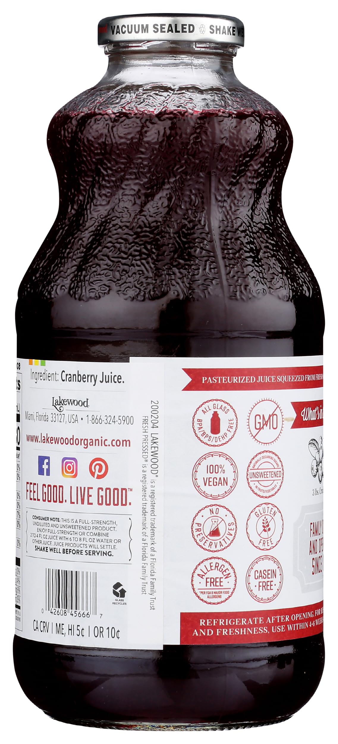 Lakewood Pure Cranberry Juice glass bottle close-up showing branding and label.