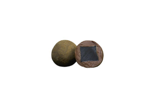 LAKRIDS BY BULOW original bar closeup reveals velvety milk chocolate over licorice core.