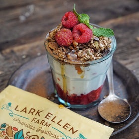 Lark Ellen Farm Berrylicious granola clusters layered in a parfait for a quick snack