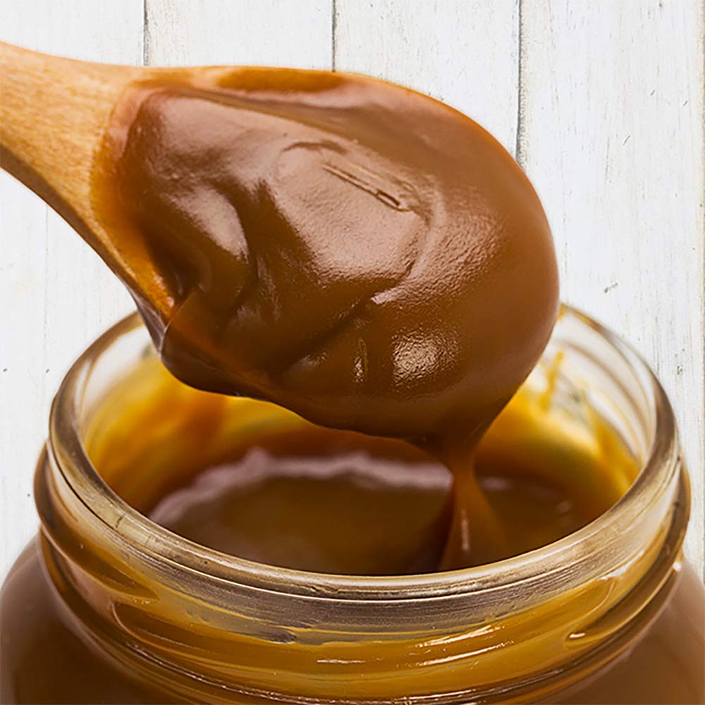 Las Quinas No Sugar Dulce de Leche on spoon highlighting silky texture