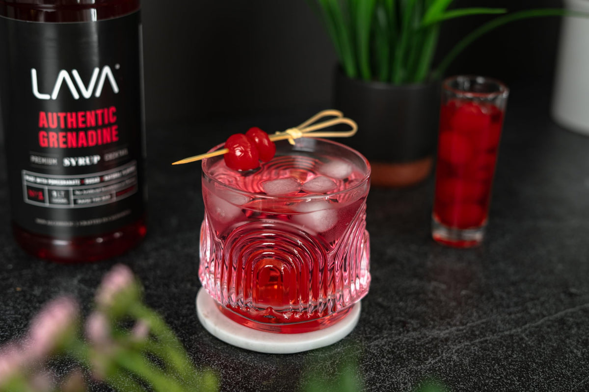LAVA Grenadine pomegranate juice splash indicating depth of flavor for drinks.