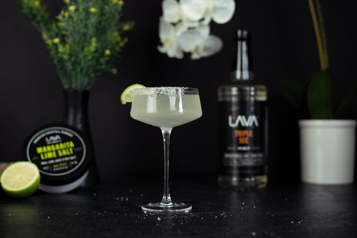 LAVA Premium Triple Sec Syrup being poured, showcasing natural orange sweetness for cocktails