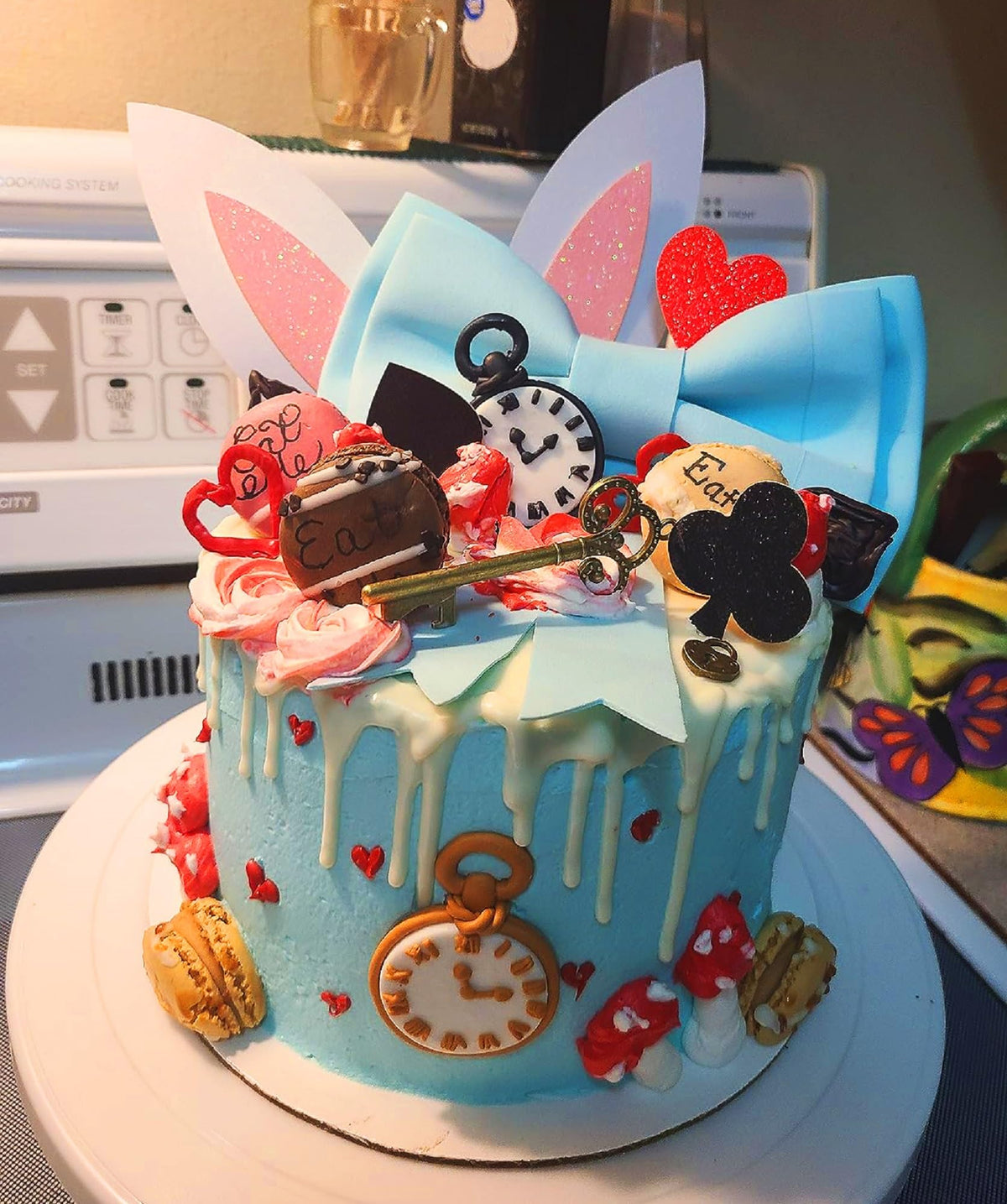 LaVenty Alice bunny ears cake topper adds whimsical charm to celebrations.