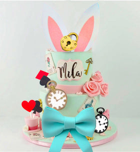 LaVenty Alice cupcake picks display on dessert table.