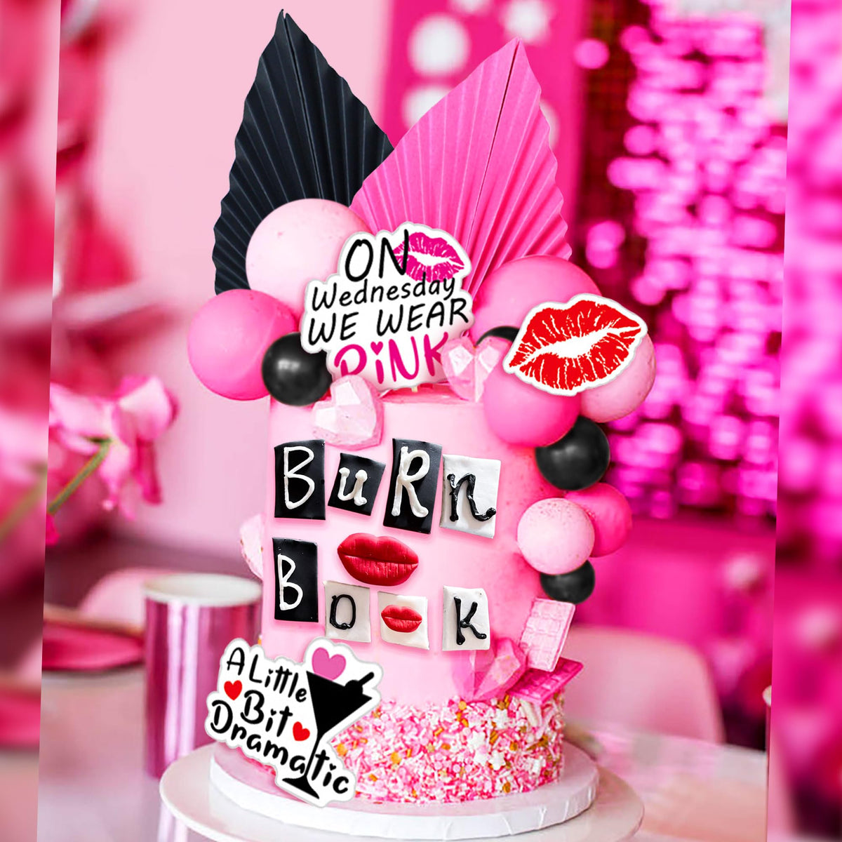 LaVenty Black palm leaf cake decoration provides bold contrast.