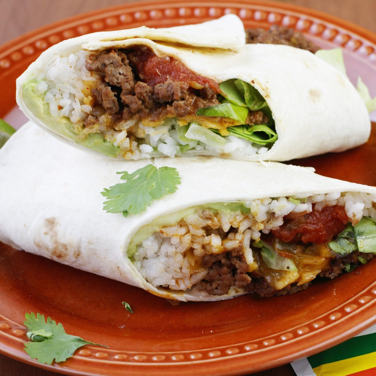 Lawry's Burrito Spice mix topping burritos with cheese and beans.