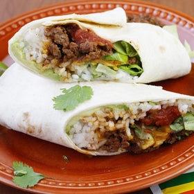 Lawry's Burrito Spice mix topping burritos with cheese and beans.