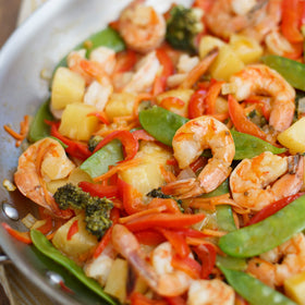 Marinade in a glass bowl with chicken marinating for quick island-inspired dinner.