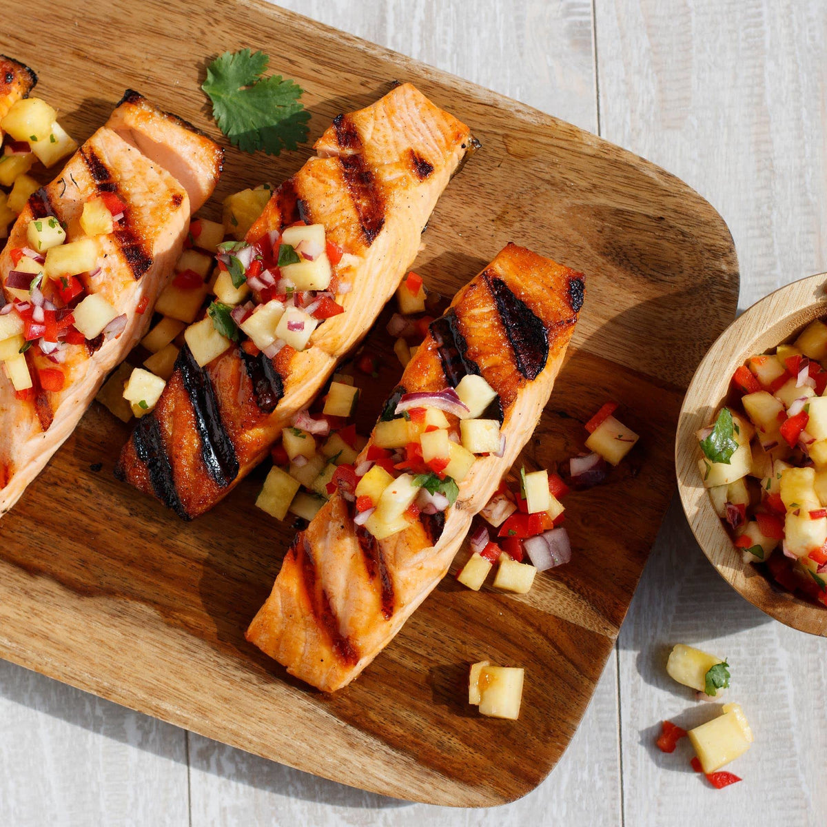 Grill scene with Lawry's Hawaiian Marinade glaze on seafood.